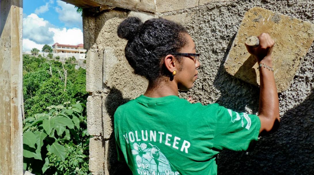 A female Projects Abroad volunteer helps plaster the walls during her building volunteer work in Jamaica. A female volunteer with Projects Abroad can be pictured helping with plastering as part of her building volunteer work in Jamaica.